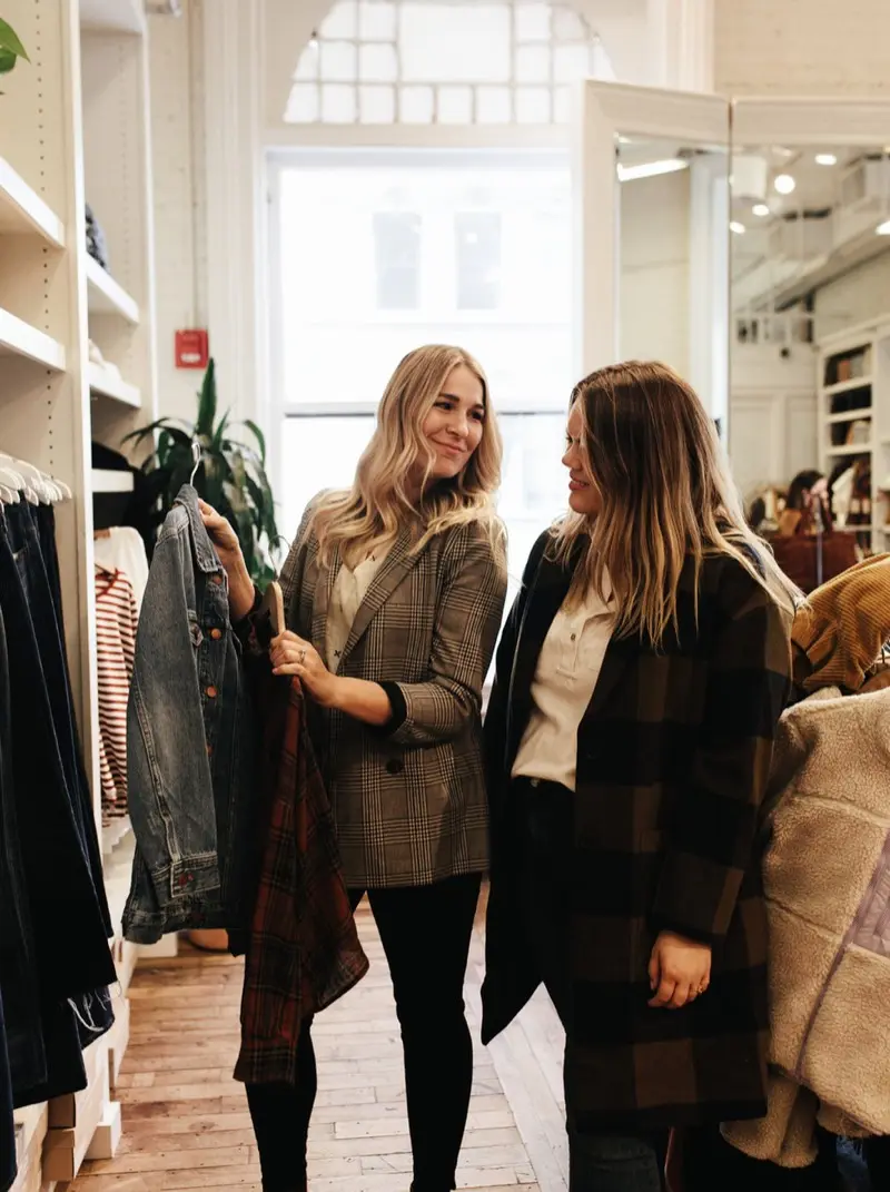 Casey Matheny helping a client choose pieces during a shopping session